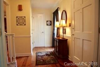 Looking from Living Room to Entry and Half Bath