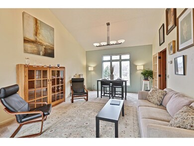 The main floor living/dining area with high ceilin