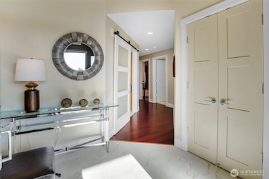 Custom tile flooring in the foyer along with handy closet is the perfect drop zone for shoes and coats.