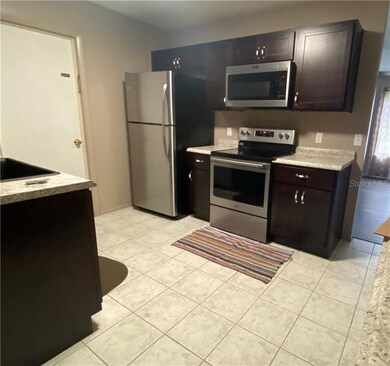 solid wood cabinets and stainless steal appliances