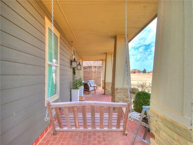 GREAT COVERED FRONT PORCH WITH SWING