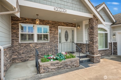 Entry has two steps and or ramp. Hardie siding.