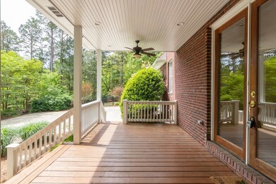SIDE PORCH AS YOU PULL UP THE DRIVEWAY