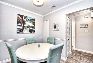 Eating area with updated lighting, chair rail, and