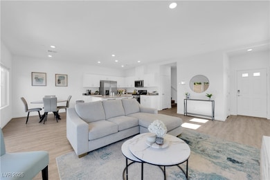 Living area featuring recessed lighting, baseboard