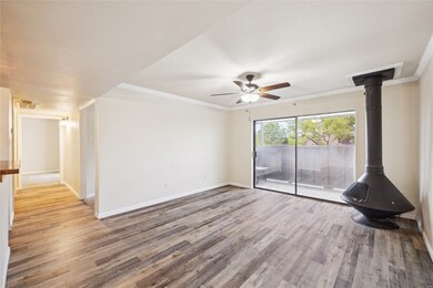 Livingroom-wood burning fireplace, patio doors
