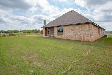 Outdoor fireplace will have a stone front and matching brick on the back