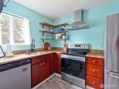 Updated kitchen with stainless appliances and granite counter tops