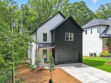 Modern inspired farmhouse with board and batten siding, an attached garage, driveway, a standing seam roof, and a metal roof