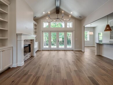 Unfurnished living room with beam ceiling, a firep