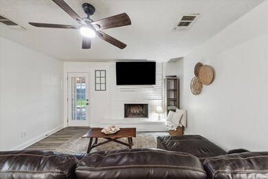 The family room is centered around a charming bric