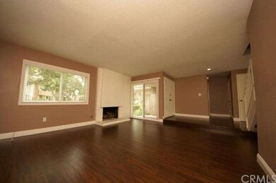 Spacious living room with fireplace.