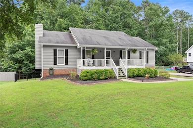 Ranch-style home featuring covered porch, a chimney, and roof with shingles