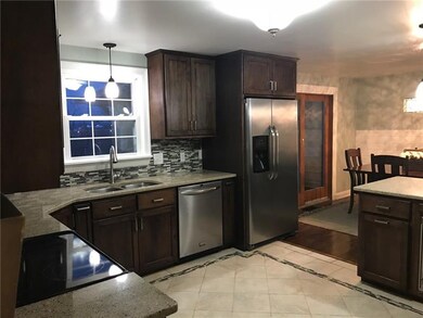 Open kitchen and dining room space with sliding gl
