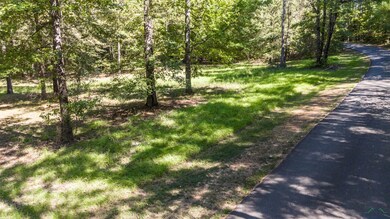 View of street featuring a wooded view
