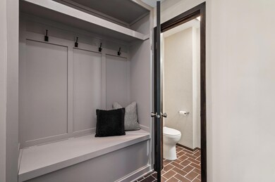 Entryway showcases new built in locker area along with bench