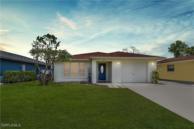 Ranch-style house with stucco siding, an attached