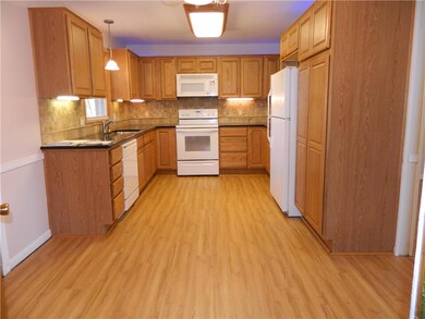 Kitchen with brand new waterproof flooring.