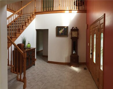 Two Story Foyer with Leaded Glass Front door
