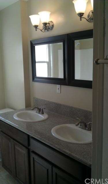 Tastefully Done Bathroom With Granite, Dual Sinks,