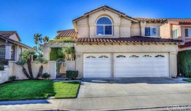 Beautiful curb appeal with lush front lawn and con