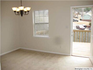 Dining room has updated lighting and opens to larg