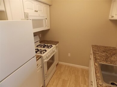 Another view of the galley kitchen design.