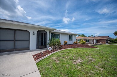 Single story home featuring stucco siding, a front
