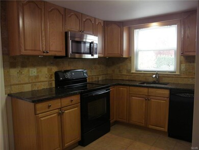 GRANITE COUNTERS & TILE BACKSPLASH IN KITCHEN