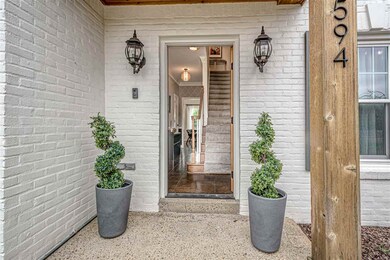 Step inside through to pretty covered front porch 