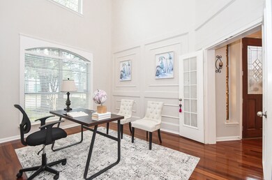 Bright home office has high ceilings and features