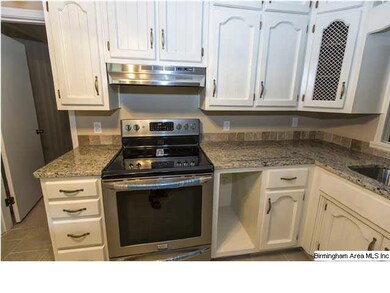 Updated Kitchen with granite countertops, tile flo