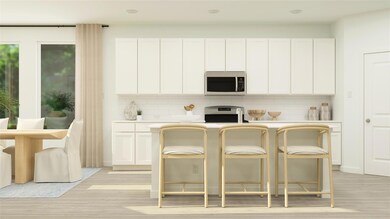 Kitchen with range, light hardwood / wood-style fl