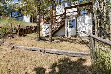 note door to basement/crawl space and stairs to deck