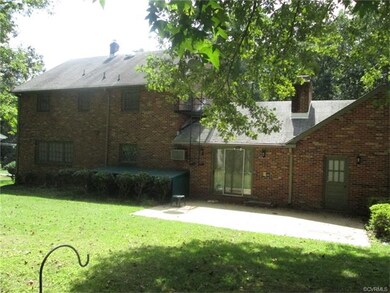 Large back yard with cement patio, canopy over bas