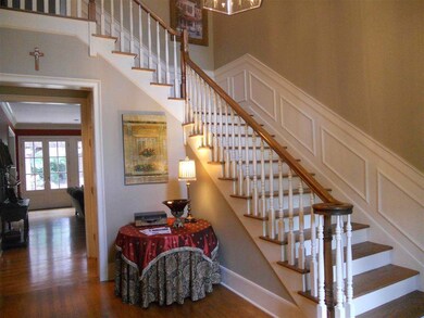 2 story entry wit Grand staircase and hardwood flo