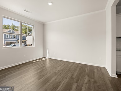 halton open dining room with large dobule window and hardwood-like flooring