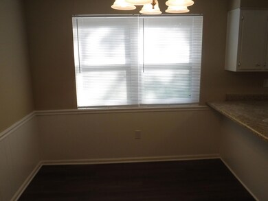 9x12 dining area with two windows