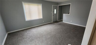 Living room featuring light carpet