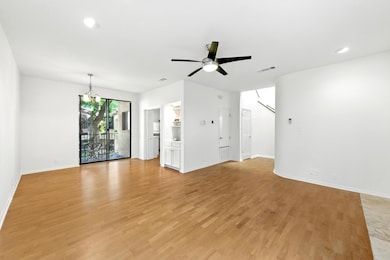Unfurnished living room featuring baseboards, cei