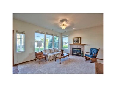 Living Room. GAS FIREPLACE WITH TILE SURROUND.