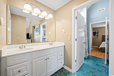 Bathroom with tile patterned flooring, vaulted cei