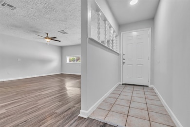 Step inside to a welcoming foyer that connects to