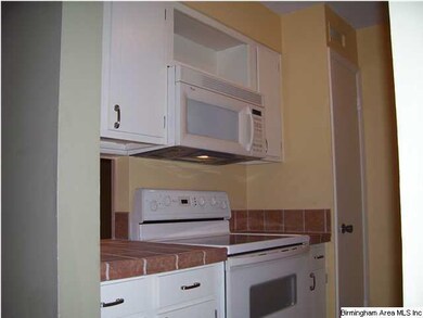 super nice kitchen. tile countertops. smooth top e