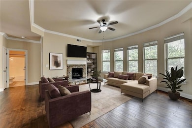 Living area with fireplace, virtually staged