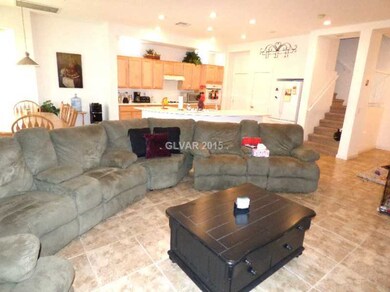 Property Photo. Living Room with staircase view an
