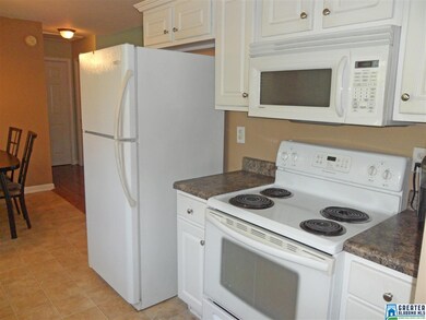 The kitchen offers matching appliances, as well as