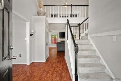 Entrance foyer with hardwood / wood-style floors