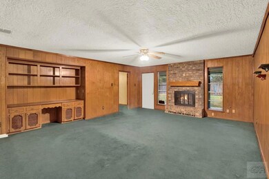 Family room with built in shelves.