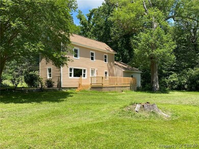 Waterside of the home with large porch to enjoy th